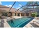 An inviting pool is enclosed and surrounded by a brick patio and lounge seating at 3427 Forest Bridge Cir, Brandon, FL 33511