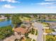 Aerial view of home in a beautiful neighborhood with a pond and golf course, enhancing the community's appeal at 3610 Montero Ct, Sun City Center, FL 33573