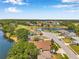 Scenic aerial view showcases a home nestled in a community with a pond and a golf course at 3610 Montero Ct, Sun City Center, FL 33573