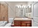 This bathroom features a shower over bath, vanity with cabinets, and neutral color scheme, creating a relaxing space at 3610 Montero Ct, Sun City Center, FL 33573