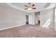Spacious bedroom boasts neutral colors, plush carpet, and connects seamlessly to other areas of the home at 3610 Montero Ct, Sun City Center, FL 33573