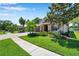 Beautifully landscaped front yard complements this lovely home with a brick-accented facade and a spacious driveway at 3610 Montero Ct, Sun City Center, FL 33573