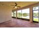 Spacious screened-in porch with panoramic views of the tranquil lake and lush landscape at 3610 Montero Ct, Sun City Center, FL 33573