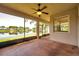 Relaxing screened-in porch offering tranquil views of the serene lake and lush green surroundings at 3610 Montero Ct, Sun City Center, FL 33573