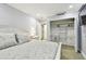 Bedroom featuring white closet, bedside table, and closet space at 36750 Us 19 N # 06111, Palm Harbor, FL 34684