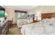 Charming bedroom with a corner window and two beds with matching comforters at 36750 Us 19 N # 06111, Palm Harbor, FL 34684