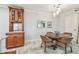 Charming dining area with a wood table, seating and a built-in bar cabinet at 36750 Us 19 N # 06111, Palm Harbor, FL 34684