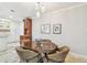 Cozy dining area with stylish lighting and a beautiful wooden table at 36750 Us 19 N # 06111, Palm Harbor, FL 34684