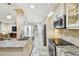 Elegant kitchen boasting granite counters, stainless appliances, and an open layout to the living area at 36750 Us 19 N # 06111, Palm Harbor, FL 34684