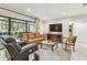 Spacious living room with a comfortable sofa, TV, and access to the outdoor patio at 36750 Us 19 N # 06111, Palm Harbor, FL 34684