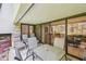 Covered patio with comfortable seating and sliding glass doors leading inside at 36750 Us 19 N # 06111, Palm Harbor, FL 34684