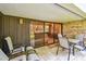 Inviting covered patio with seating, perfect for outdoor dining and relaxation with easy access inside at 36750 Us 19 N # 06111, Palm Harbor, FL 34684