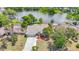 Scenic aerial shot of home with lake views and well-manicured lawn at 3810 Hollister Pl, Brandon, FL 33511