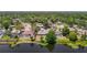 Overhead view reveals a neighborhood, with this home next to a lake and several with pools at 3810 Hollister Pl, Brandon, FL 33511