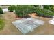 An aerial shot features a full outdoor basketball court with playground in the background at 3810 Hollister Pl, Brandon, FL 33511