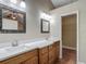 Bathroom features a double vanity, wood-look floors, decorative mirrors and recessed lighting at 3810 Hollister Pl, Brandon, FL 33511