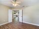 Bedroom with wood floors with views to the kitchen and dining area at 3810 Hollister Pl, Brandon, FL 33511