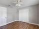 Bedroom with wood floors, ceiling fan and closet at 3810 Hollister Pl, Brandon, FL 33511