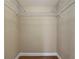 This walk-in closet features wood-look floors and a metal shelving system for ample storage at 3810 Hollister Pl, Brandon, FL 33511