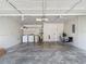 Well-organized garage featuring laundry area, shelving, and ample space for parking and storage at 3810 Hollister Pl, Brandon, FL 33511