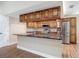 Kitchen with island, stainless appliances, granite countertops, tile backsplash and wood cabinets at 3810 Hollister Pl, Brandon, FL 33511