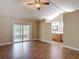 Spacious main bedroom with wood floors, vaulted ceiling and sliding glass doors to the patio at 3810 Hollister Pl, Brandon, FL 33511