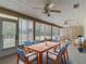 A cozy sun room features tile flooring, lots of windows, and comfortable furniture at 3810 Hollister Pl, Brandon, FL 33511