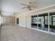 Spacious sunroom with tile flooring, ceiling fans and sliding glass doors, perfect for entertaining and relaxation at 3810 Hollister Pl, Brandon, FL 33511
