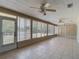Enclosed sunroom featuring tile floors, neutral paint and views of the backyard at 3810 Hollister Pl, Brandon, FL 33511