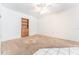 Bedroom featuring tile and carpet flooring with a built-in bookcase at 4104 W Watrous Ave, Tampa, FL 33629