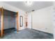 Bedroom features a closet, neutral walls, and blue carpeting throughout at 4104 W Watrous Ave, Tampa, FL 33629