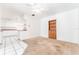Cozy living area seamlessly connects to the kitchen, featuring a built-in bookcase and ample space at 4104 W Watrous Ave, Tampa, FL 33629