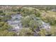 Charming townhouses surrounded by lush greenery, mature trees, and serene pond create an inviting community atmosphere at 4137 Northmeadow Cir, Tampa, FL 33618