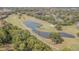 Picturesque golf course view with a serene pond surrounded by lush greenery and mature trees offering a tranquil setting at 4137 Northmeadow Cir, Tampa, FL 33618