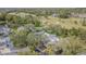 Scenic aerial view of the townhouse complex nestled along a lush golf course with mature trees and tranquil ponds at 4137 Northmeadow Cir, Tampa, FL 33618
