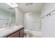 Bathroom featuring a granite countertop, sink, toilet, and sliding glass shower doors at 4137 Northmeadow Cir, Tampa, FL 33618