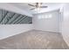 Spacious bedroom with neutral carpet, ceiling fan, and a window with shutter blinds at 4137 Northmeadow Cir, Tampa, FL 33618