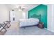 Spacious bedroom with a vibrant green accent wall, carpet, bed and an ensuite bathroom at 4137 Northmeadow Cir, Tampa, FL 33618