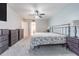 This bedroom boasts a ceiling fan, plush carpeting, and neutral wall colors to create a serene and inviting ambiance at 4137 Northmeadow Cir, Tampa, FL 33618