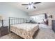 Relax in a spacious bedroom, adjoining living space, complete with ceiling fan, plush carpeting, and neutral wall colors at 4137 Northmeadow Cir, Tampa, FL 33618