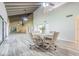 The dining area features a table with four chairs and wood-look flooring at 4137 Northmeadow Cir, Tampa, FL 33618