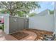 Backyard with lush mulch, a large storage shed, and a white privacy fence at 4137 Northmeadow Cir, Tampa, FL 33618