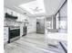 Bright kitchen with stainless steel appliances, white cabinets, and modern countertops at 4137 Northmeadow Cir, Tampa, FL 33618
