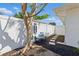 Tranquil backyard with a bench under a tree and stepping stones at 4219 26Th N Ave, St Petersburg, FL 33713