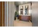 Modern bathroom with a double vanity, unique mirrors, and decorative pendant lighting at 4219 26Th N Ave, St Petersburg, FL 33713
