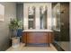 Stylish bathroom with a double vanity, modern lighting fixtures, and a glass-enclosed shower at 4219 26Th N Ave, St Petersburg, FL 33713