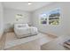 Serene bedroom with bright windows, a bed with white linens, and neutral decor at 4219 26Th N Ave, St Petersburg, FL 33713