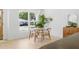 Dining area features a round white table, four wooden chairs, and natural light at 4219 26Th N Ave, St Petersburg, FL 33713