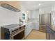 Stylish kitchen with light-green cabinetry, modern appliances, and bright natural light at 4219 26Th N Ave, St Petersburg, FL 33713