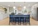 Modern kitchen with a large island, bar stool seating, and stainless steel appliances offering functionality and style at 4219 26Th N Ave, St Petersburg, FL 33713